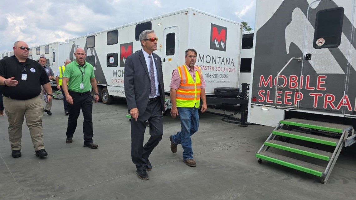 FLETC Director Benjamine C. Huffman tours the turnkey base camp housing Federal Emergency Management Agency (FEMA) and local power companies, impacting the response to restore power to affected communities by Hurricane Helene, on the Federal Law Enforcement Training Centers in Glynco, Ga., Oct. 2, 2024.  (FLETC OPA/David Tucker)