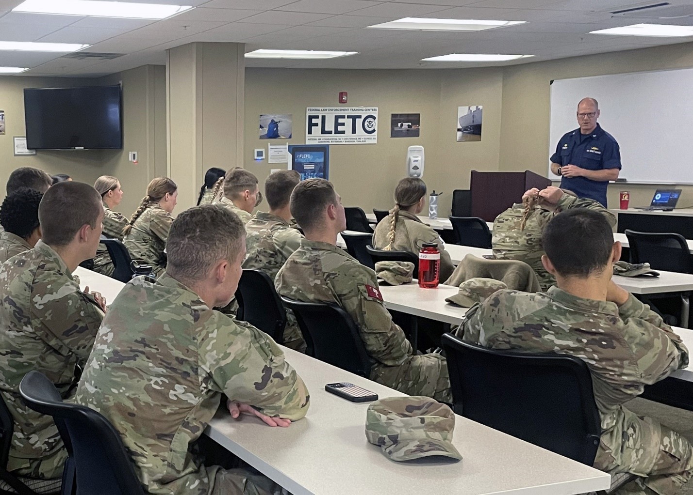 US Coast Guard Captain James Corbett briefs visiting Citadel Cadets participated in Leadership Day, dedicated to fostering leadership development among cadets through community service and hands-on experiences, at the Federal Law Enforcement Training Centers Charleston, Oct. 16, 2024.  (FLETC Instructor/Melissa Graves)