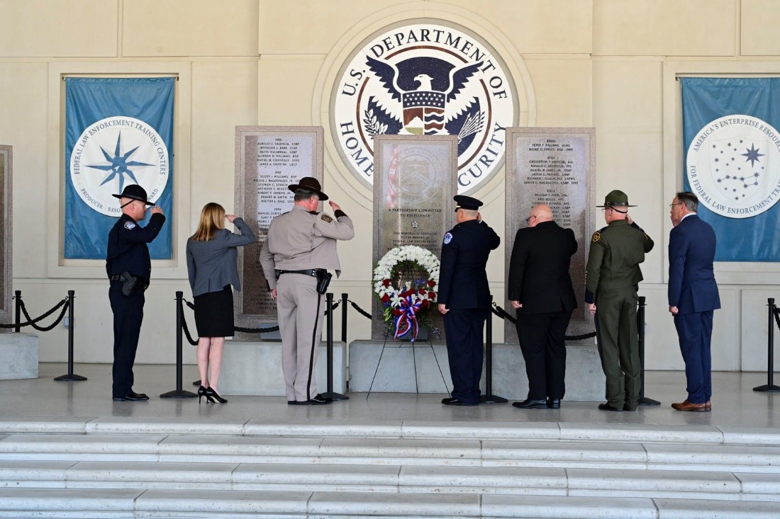 The Federal Law Enforcement Training Centers and Partner Organization representatives renders honors to the fallen at the FLETC Graduates Memorial during ceremony on May 7, 2024, in Glynco, Georgia. (David Tucker/OPA)