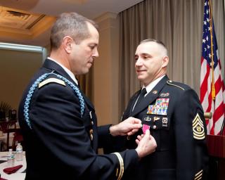 Instructor Glenn Guy received the Legion of Merit award during a military award ceremony at the FLETC. 
